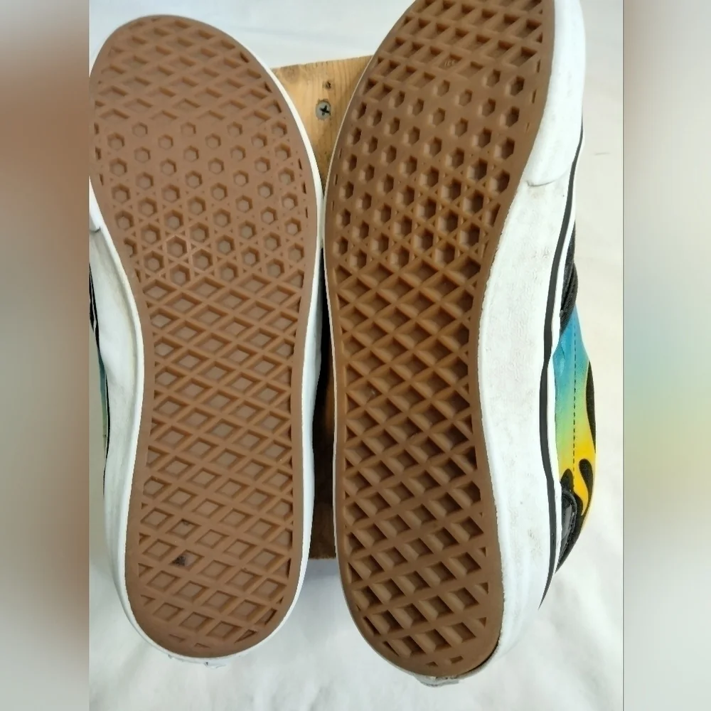 Vans slip on shoe. Size 7. Black  with blue/green and yellow🔥 running down side